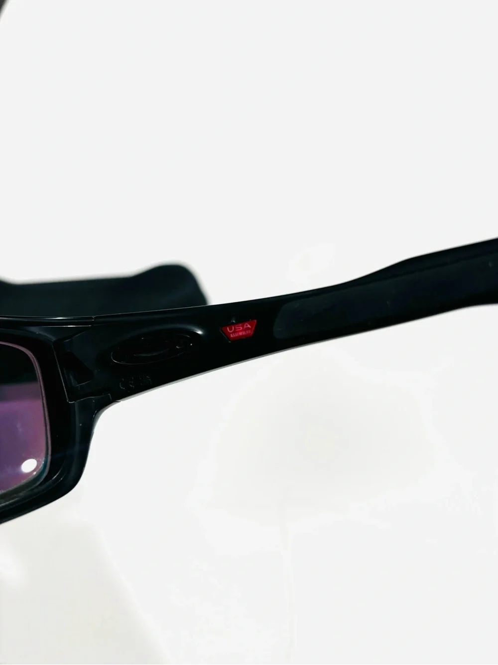 Oakley Black Frame Sunglasses with Green-Blue Mirrored Lenses
